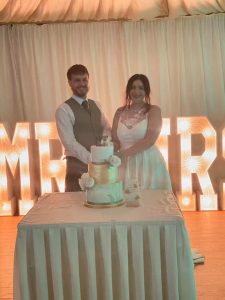 couple cutting wedding cake testimonial