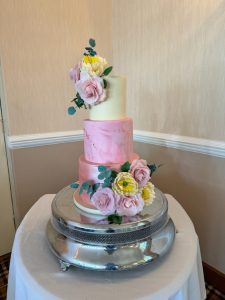 Pink floral unique wedding cakes in Fife