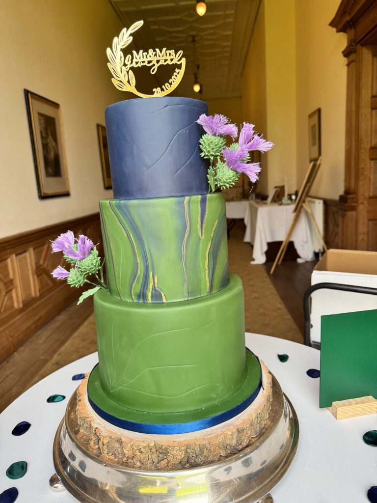 Sophisticated navy and green marble-effect luxury wedding cake for a Perthshire estate wedding