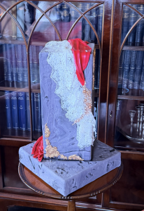 Bespoke sculptural wedding cake featuring delicate lace detailing on display at Bardmony Estate