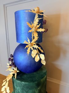 Modern gold thistle artistry on a sculptural wedding cake designed for contemporary Edinburgh gallery weddings.