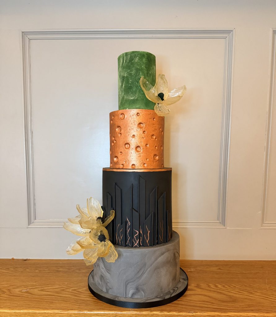Bespoke copper and black geometric wedding cake with architectural textures for luxury St Andrews weddings. Dundee industrial venues