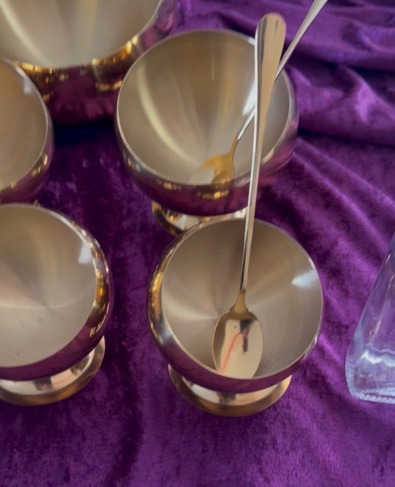 Luxury wedding cake sensory apothecary station by Crumbdidilyumptious, featuring brushed gold bowls and spoons on deep purple velvet for The Descent experience in Scotland.