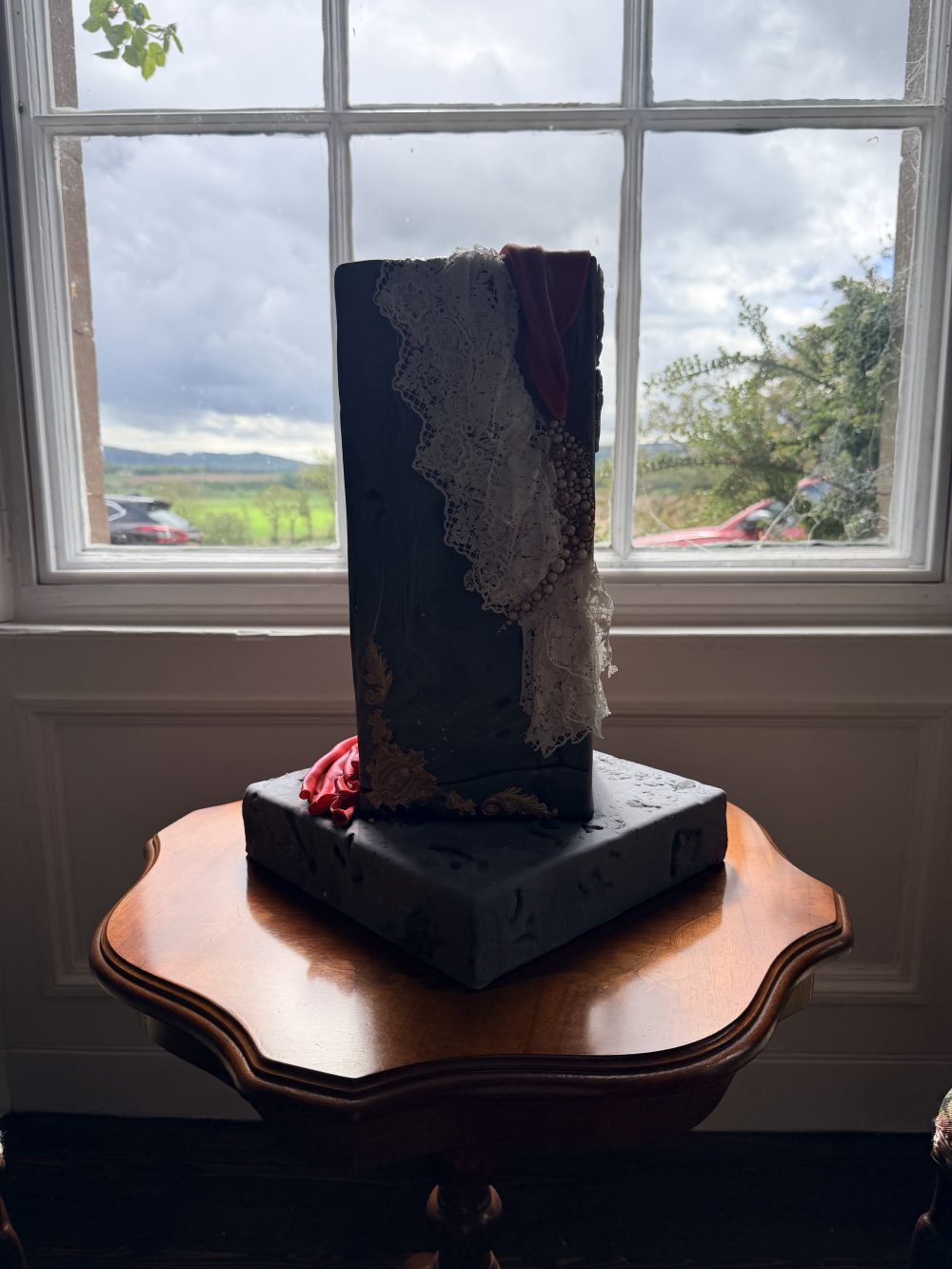 Contemporary red and slate grey sculptural monolith wedding cake by Crumbdidilyumptious