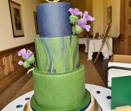 Sophisticated navy and green marble-effect luxury wedding cake for a Perthshire estate wedding